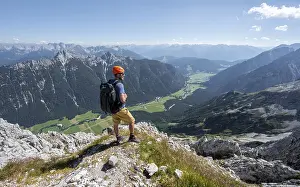 Mountaineer at the summit of the Obere Wettersteinspitze