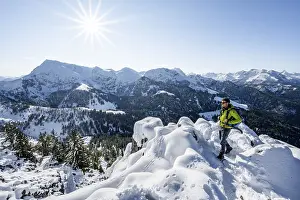 Mountaineers on the snowy summit of the Jenner in autumn
