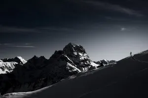 Mountaineers in front of the summit of the Grosser Widderstein in winter