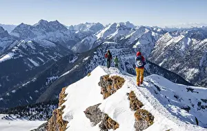 Mountaineers in winter in the snow