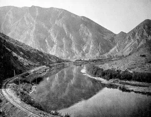 Mountainous landscape in the background and the railway line along the Jefferson Canon in the state of Montana