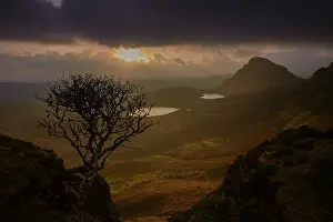 Mountainous landscape with dramatic lighting