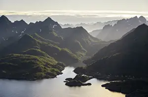 Mountains and fjord landscape with atmospheric evening light