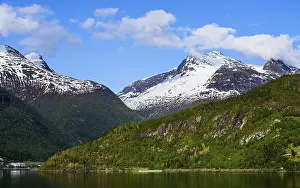 Mountains and Fjord over Norwegian Village