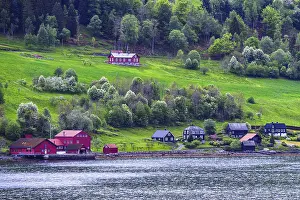 Mountains and Fjord over Norwegian Village