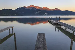 Mountains reflected in lake, footbridge