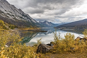 Mountains reflected in a lake, Medicine Lake