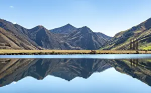 Mountains reflecting in lake, Moke Lake near Queenstown