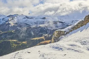 Mountains and valleys with clouds on a sunny day at Hochalpenstrasse
