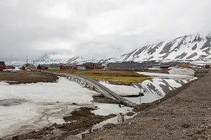 Mountains and wooden houses in a cloudy day in Ny Alesund