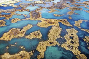 Multicolored labyrinth between rocks in the water from different minerals and underground springs