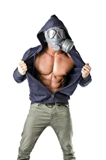 Muscular man wearing antigas mask