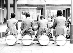 Musicians sit on their instruments, ca