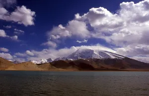 Muztagh Ata, or Muztagata (Uyghur: ice-mountain-father')