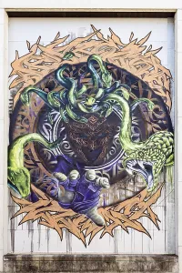 Mythical motif with Medusa and several snakes in a circular design