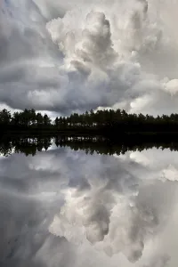 Naeveretjaern Lake with dramatic clouds and mirroring