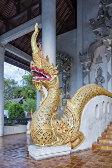 Naga, sacred snake, on chapel's front porch