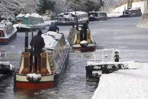 Narrow boats in the snow, thick ice at locks