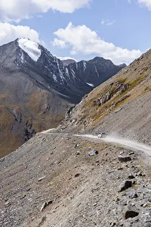 Narrow gravel track in mountain landscape at Chong Ashuu Pass