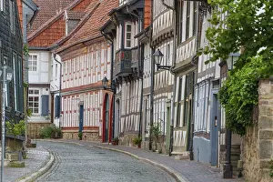 Narrow old town alley with half-timbered houses and traditional architectural elements