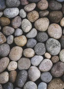 Natural pebbles texture, sea stones moody background