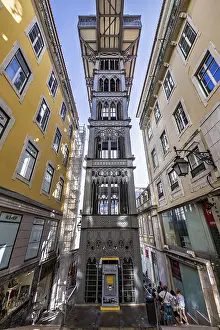 Neo-gothic style elevator connecting lower streets with a higher urban district in Lisbon
