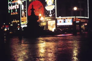 Neon light advert at night, Piccadilly Circus, London, England, Great Britain Christmas 1959