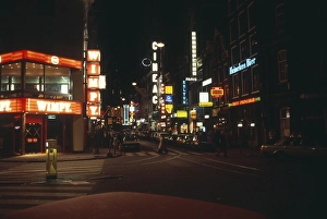 Neon lights in the city centre of Amsterdam at night, Netherlands 1970s 1980s, Wimpy fast food restaurant