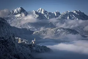 Neuschwanstein Castle with snowy mountains