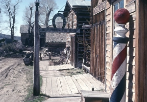 Nevada City historic ghost town, Montana, USA barber pole striped sign 1976