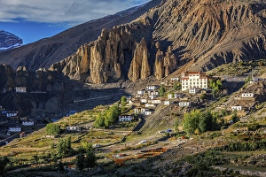 Category Buddhism Prints: New Dhankar gompa (monastery) and Dhankar village on sunset