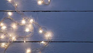 New year festoon on empty wooden floor