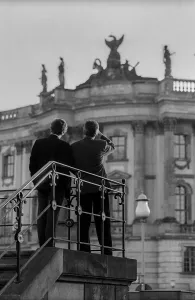 NGermany, Berlin, 19 May 1991, two men looking at the chest of drawers