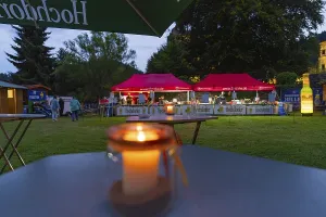 Night shot of a festival with candlelight on tables