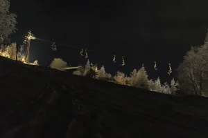 Night shot of the ski lift on the ski slope in Eibenstock