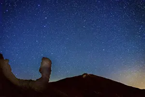 The night sky and Teide volcano in the background