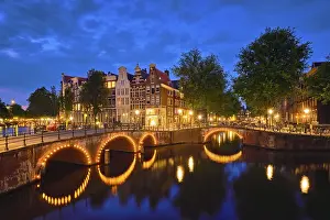 Night view of Amterdam cityscape with canal