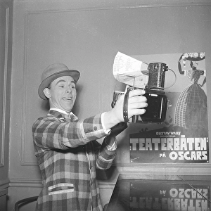 Nils Poppe, 1908-2000, Swedish actor. Here he immortalizes himself by holding a camera in his hand and pointing it at his happy face. A visual proof that the modern so-called selfie is nothing new. Sweden in 1943 Kristoffersson ref C27-4