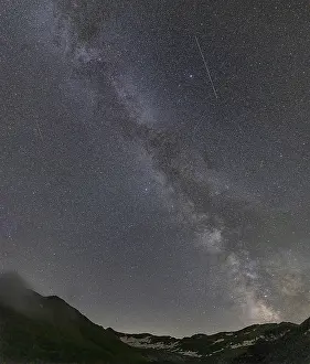 Nocturnal starry sky over the Furka Pass in the Swiss Alps