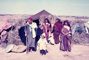 Nomadic Bedouin people by their desert tent in North Africa