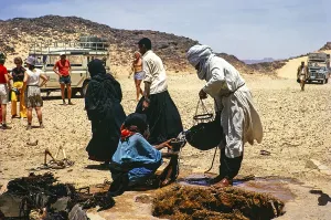 Nomads drawing water from a well, travelling group Minitrek Expeditions, near Djanet, Algeria, North Africa 1973, Africa