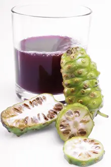 Noni juice and fresh noni fruit