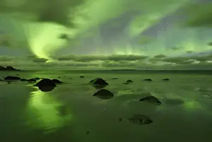 Northern Lights, Aurora Borealis above the beach of Utakleiv