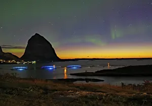 Northern lights (aurora borealis) mingle with sunset