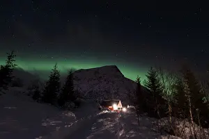 Northern Lights or Aurora Borealis over the mountain Vatterfjordtinden