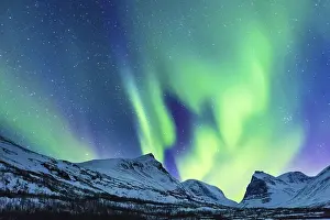 Northern Lights (Aurora borealis) over mountains