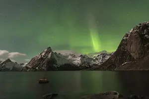 Northern Lights or Aurora Borealis over mountains