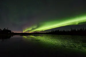Northern Lights (Aurora borealis) reflected in the Taerendoeaelven