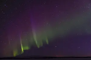 Northern Lights (Aurora borealis) over snowy landscape