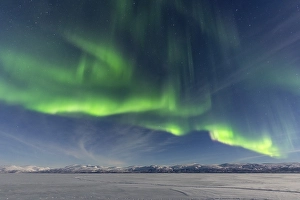 Northern Lights (Aurora Borealis) over snowy mountains